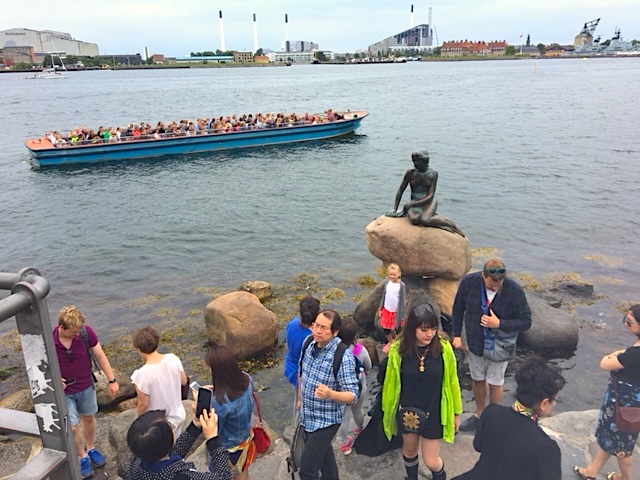 Little Mermaid statue in the harbor depicts a mermaid becoming human